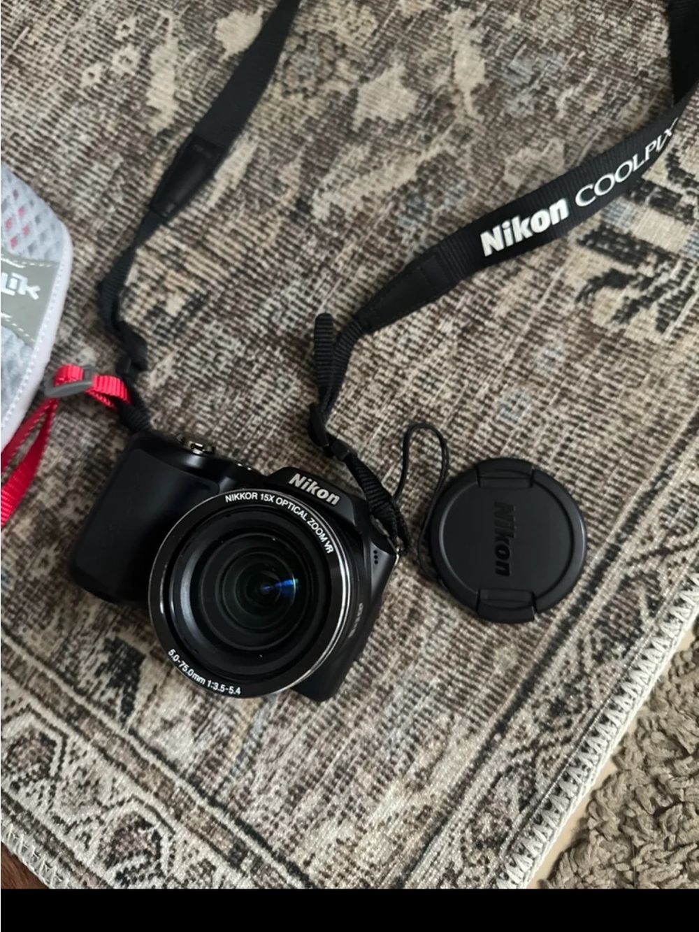 Nixon Black Compact Camera with Detachable Lens Cap and Neck Strap